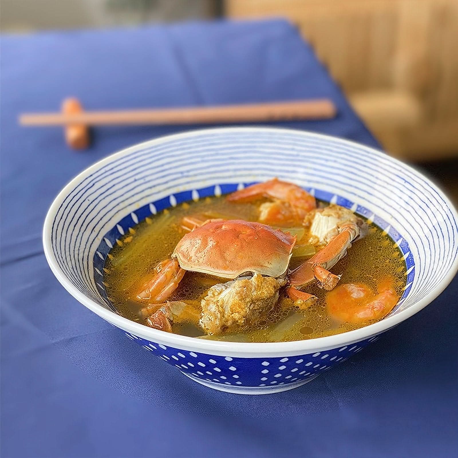 Blue and white pattern Japanese ramen bowl with seafood, large ceramic rice plate
